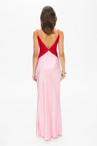 Model in maxi contrast Terrin dress on straps with a cut on the bodice back view