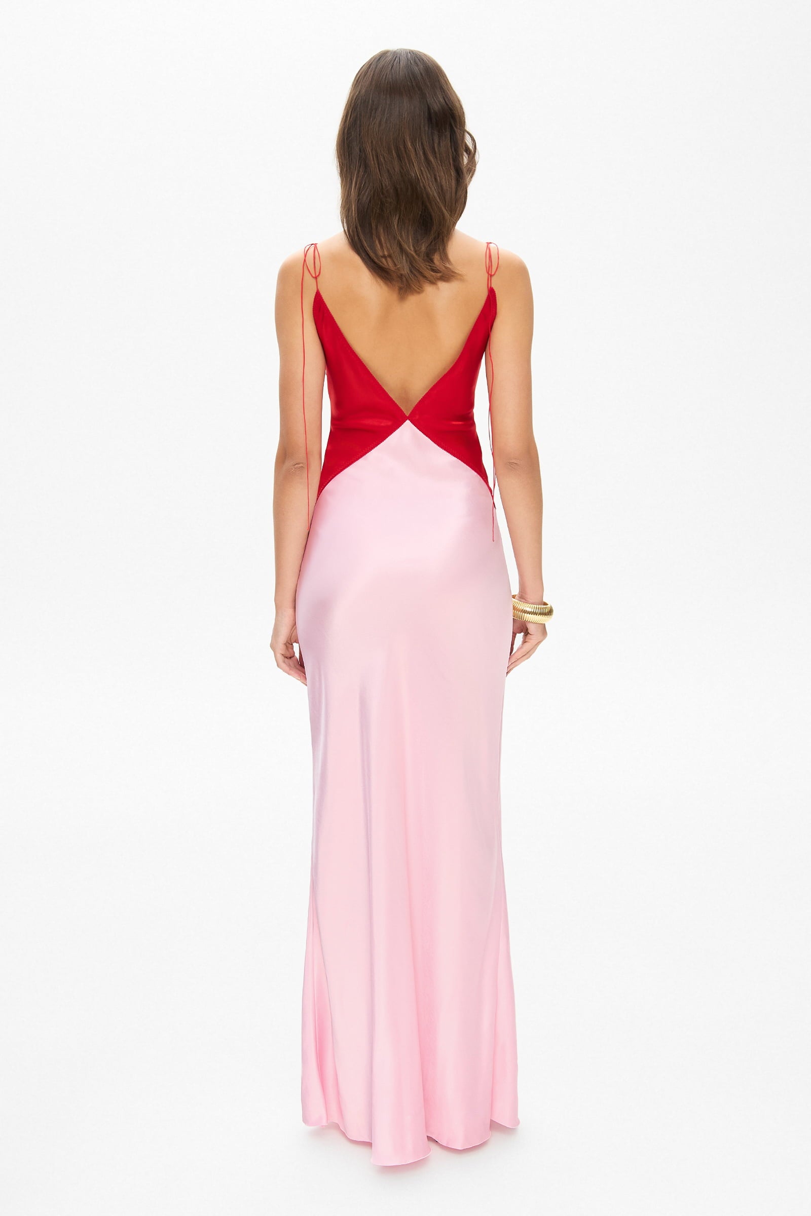 Model in maxi contrast Terrin dress on straps with a cut on the bodice back view