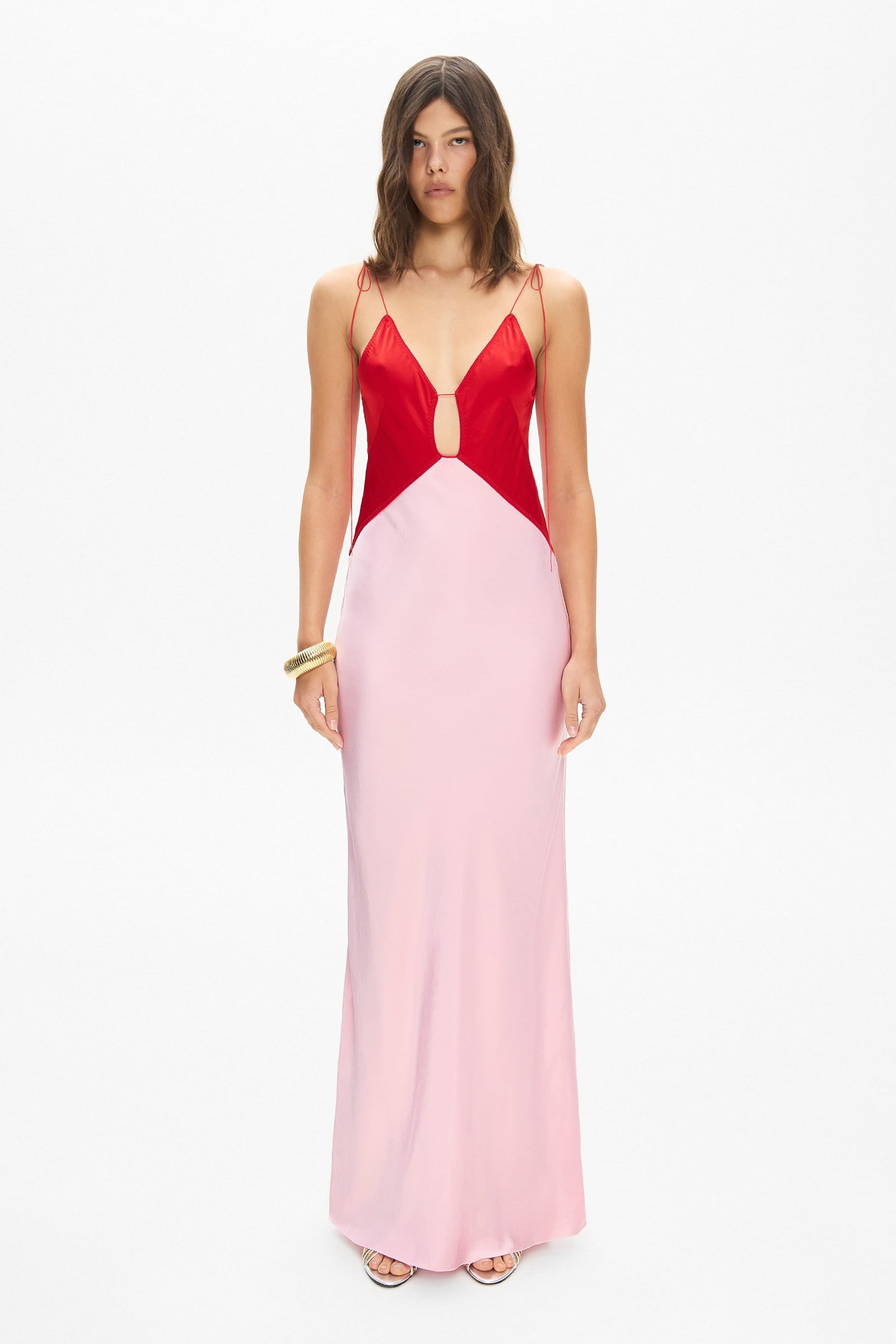 Model in maxi contrast Terrin dress on straps with a cut on the bodice front view