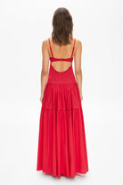 Model in bustier style bodice maxi Yulitta dress with a wide skirt back view