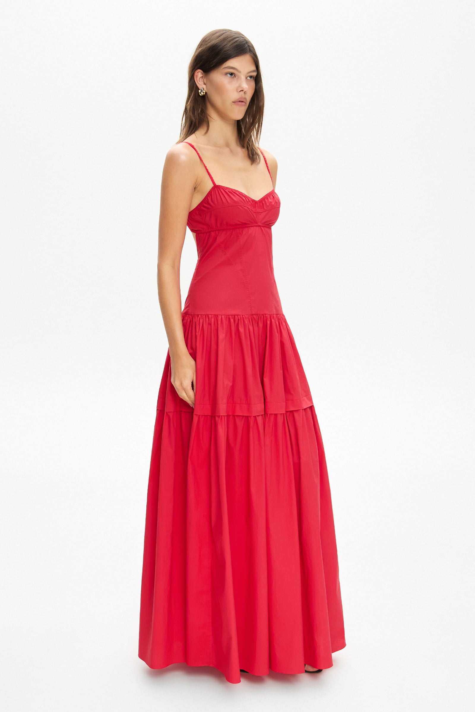 Model in bustier style bodice maxi Yulitta dress with a wide skirt side view