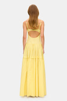 Model in bustier style bodice maxi Yulitta dress with a wide skirt back view