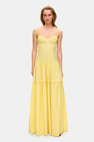 Model in bustier style bodice maxi Yulitta dress with a wide skirt front view