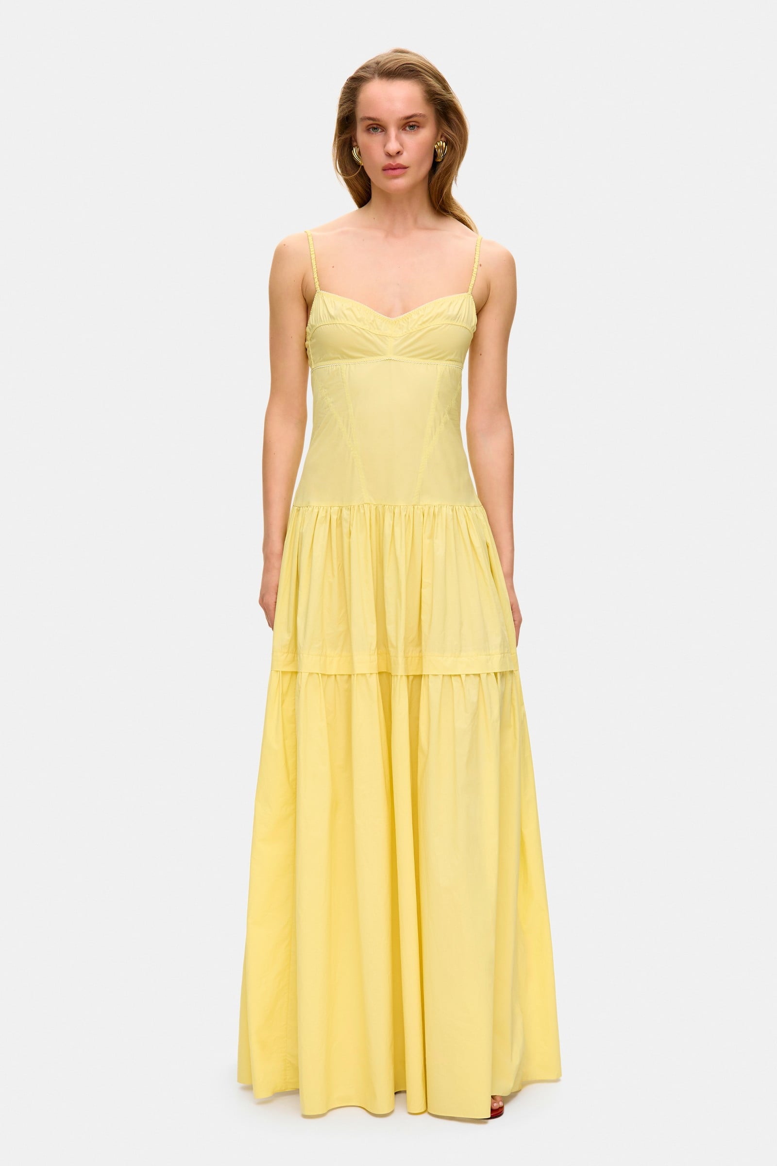 Model in bustier style bodice maxi Yulitta dress with a wide skirt front view