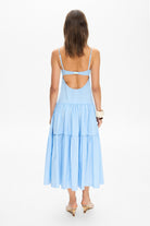 Model in bustier style bodice midi Calliope dress with a wide skirt back view