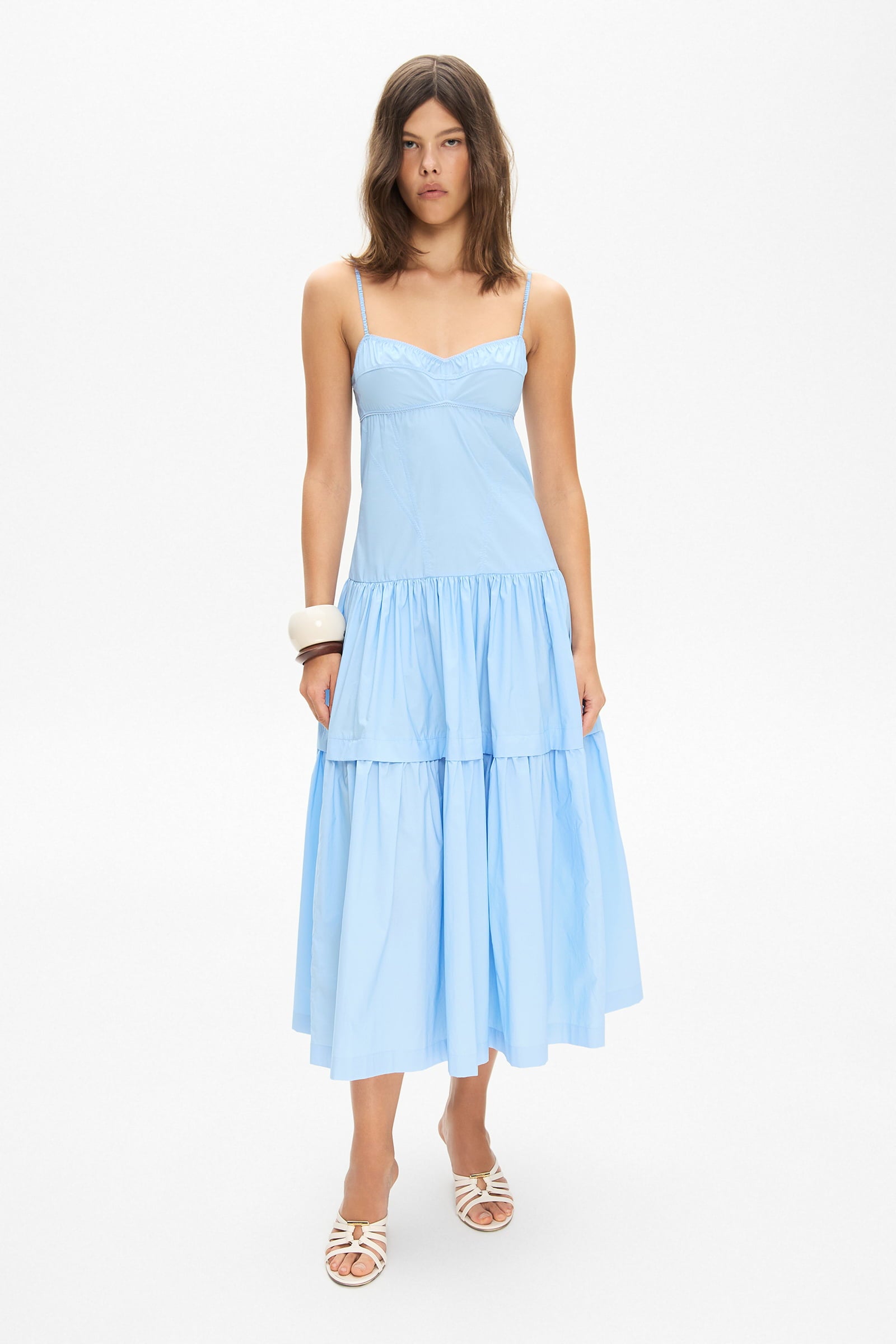 Model in bustier style bodice midi Calliope dress with a wide skirt front view