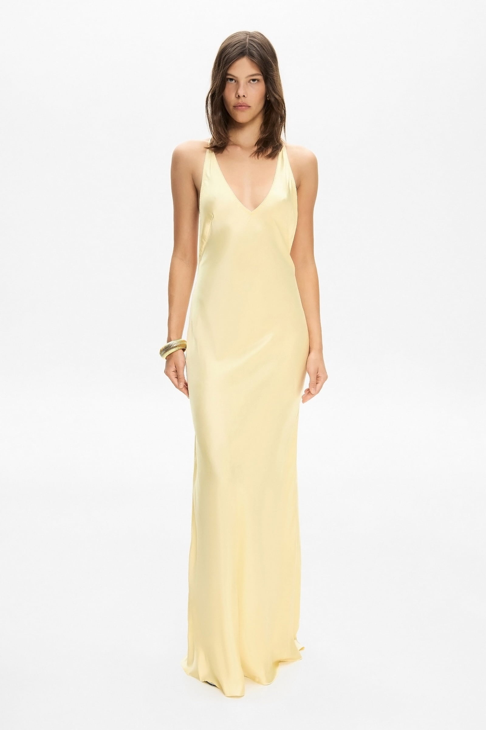 Model in open back Justina maxi dress with open shoulders front view