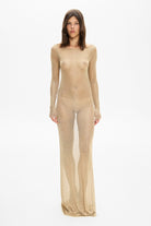 Model in long sleeved maxi silhouette Goldie dress with a drapery on back front view