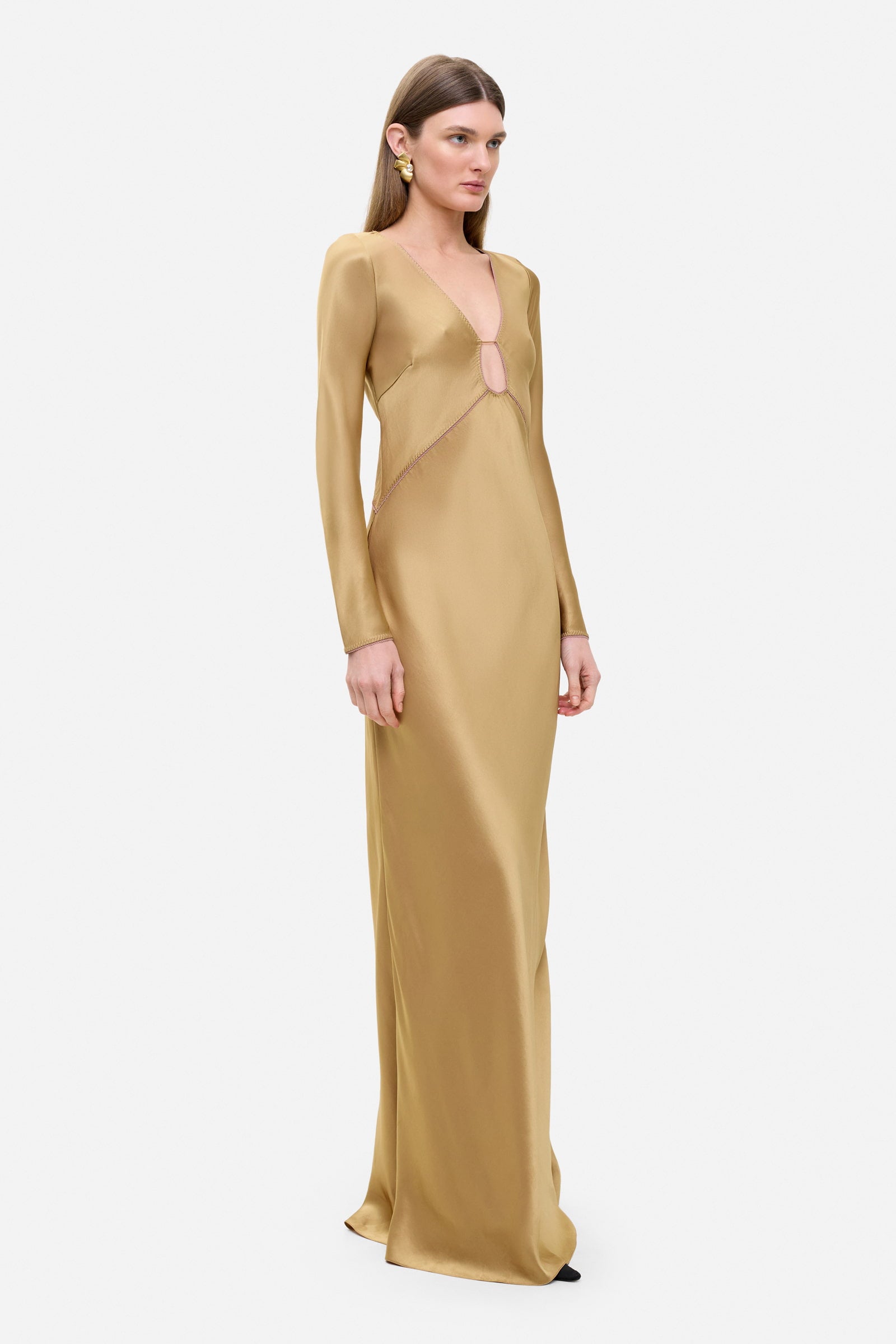 Model in long-sleeved Celeste maxi dress with a cut on the top side view