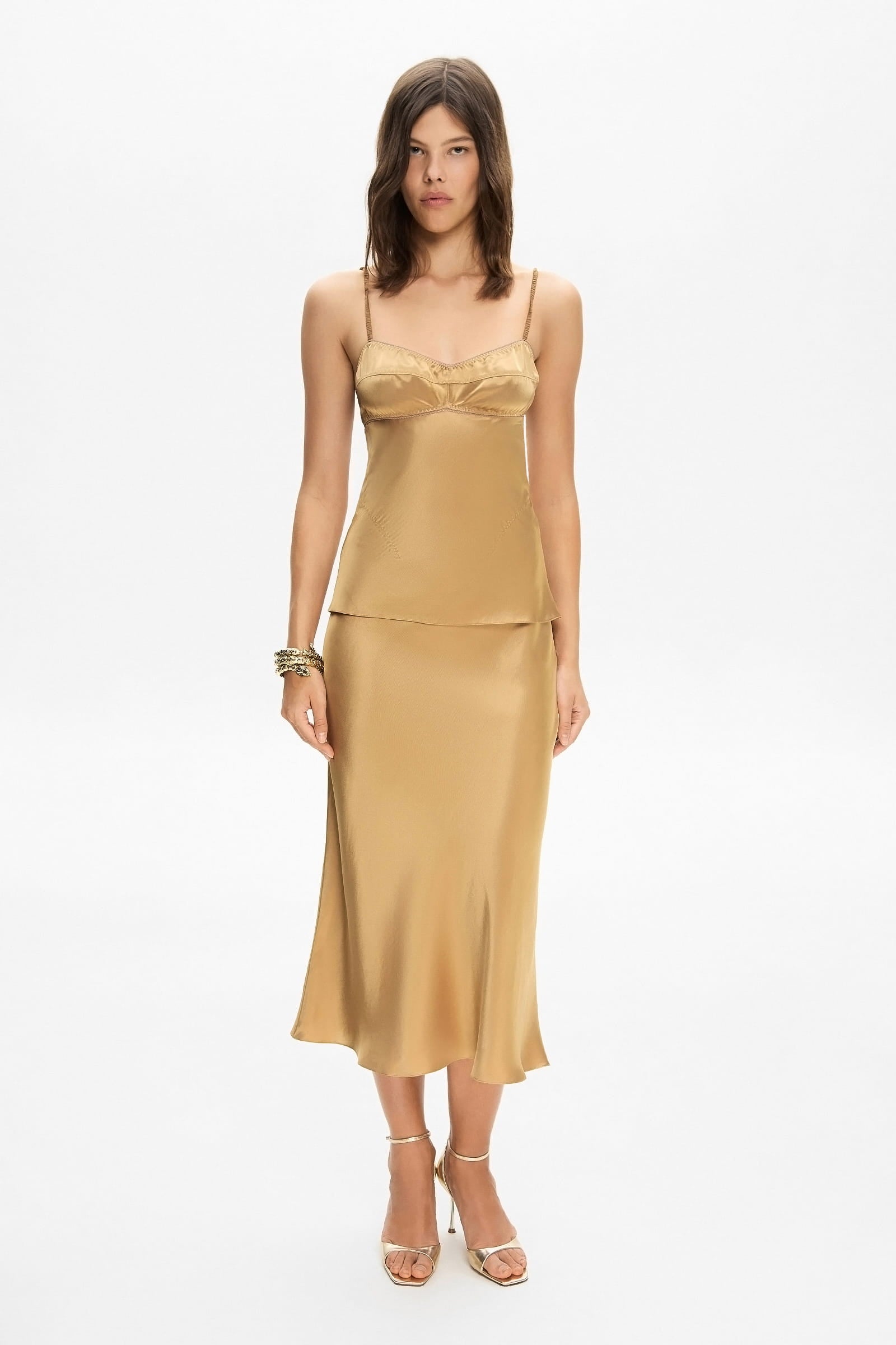 Model in midi Champaca skirt with stitches on hips front view