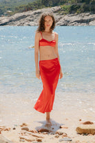 Model in Champaca midi skirt with stitches on hips front view
