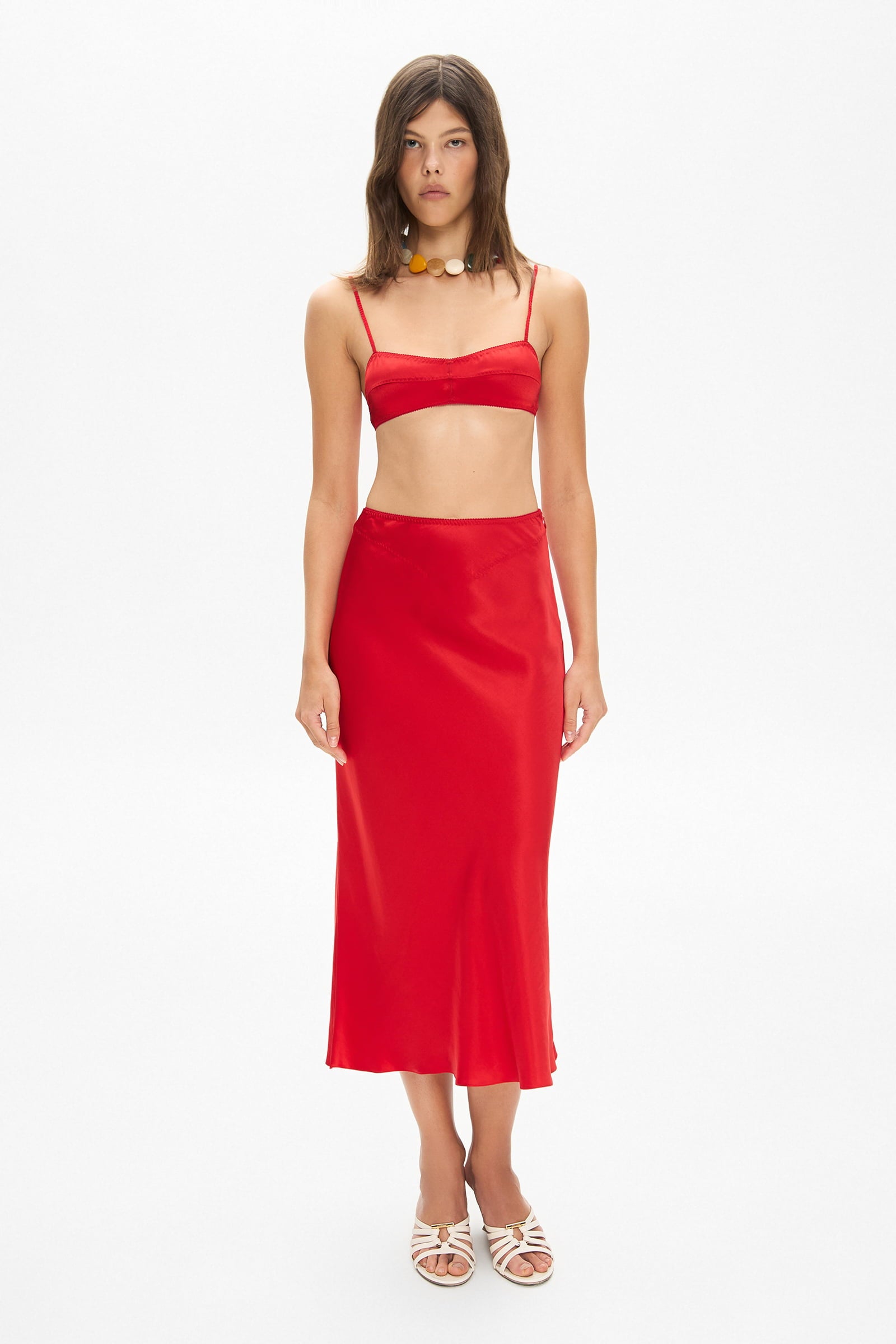 Model in Champaca midi skirt with stitches on hips front view