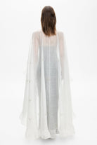 Model in Bernadette cape with embroidery handmade back view