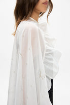 Model in Bernadette cape with embroidery handmade details side view