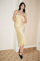 Model in lemon yellow Waterlily dress