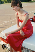 Model in red Waterlily Lux dress