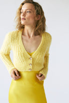 Model in yellow Zoey cardigan