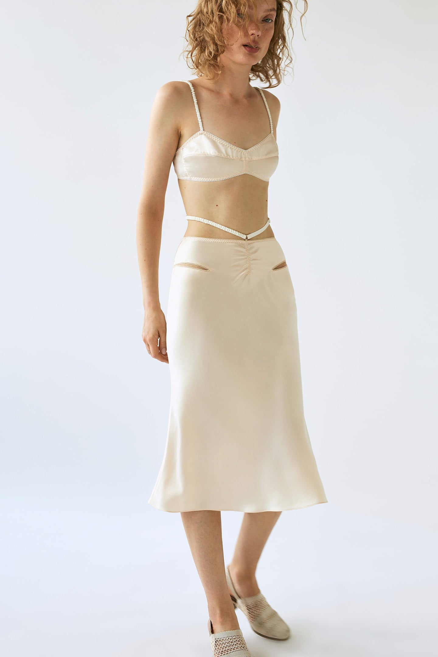 Model in cream Sula skirt