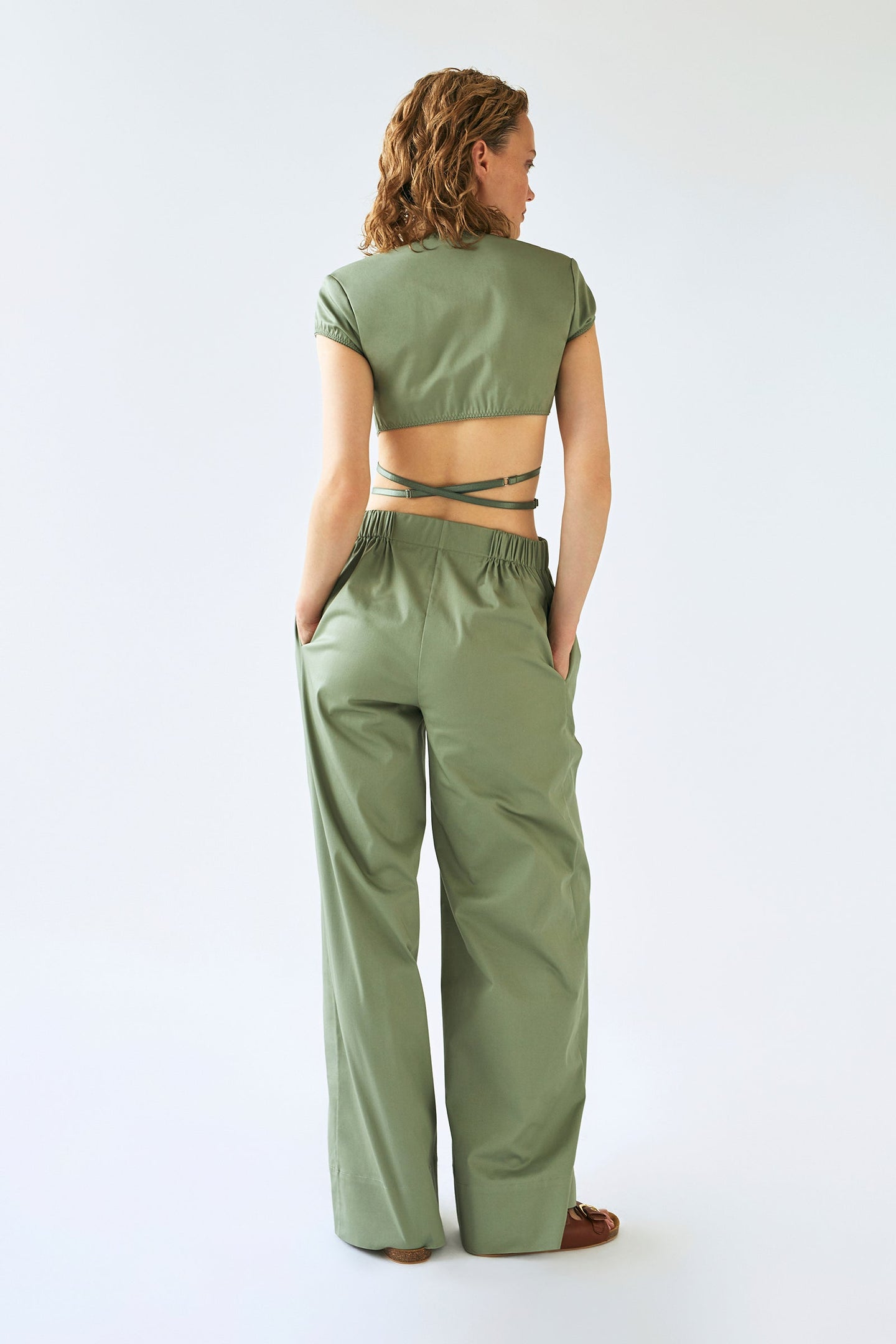 Model in olive Melba trousers