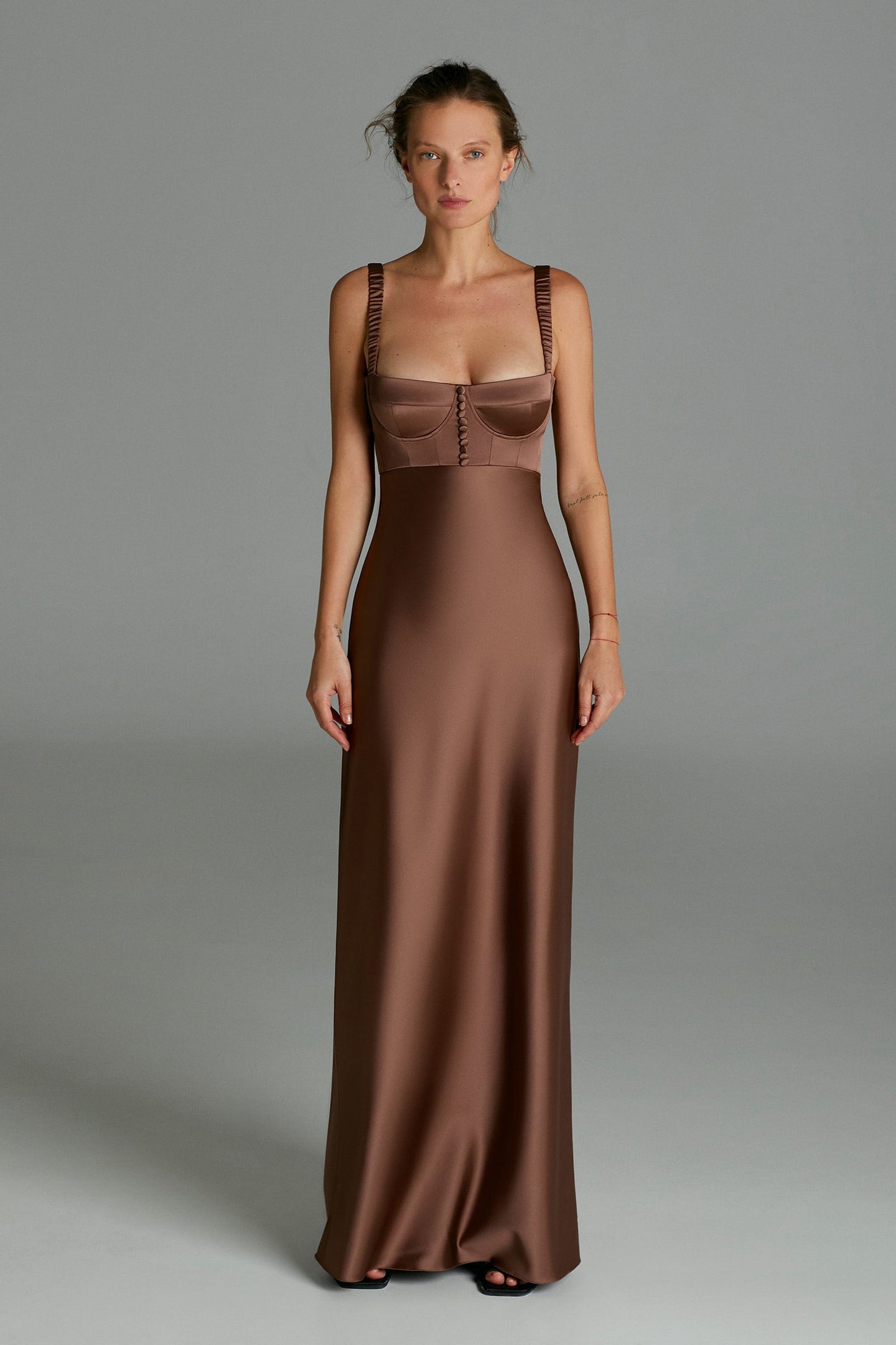 Model in brown Aglaya dress