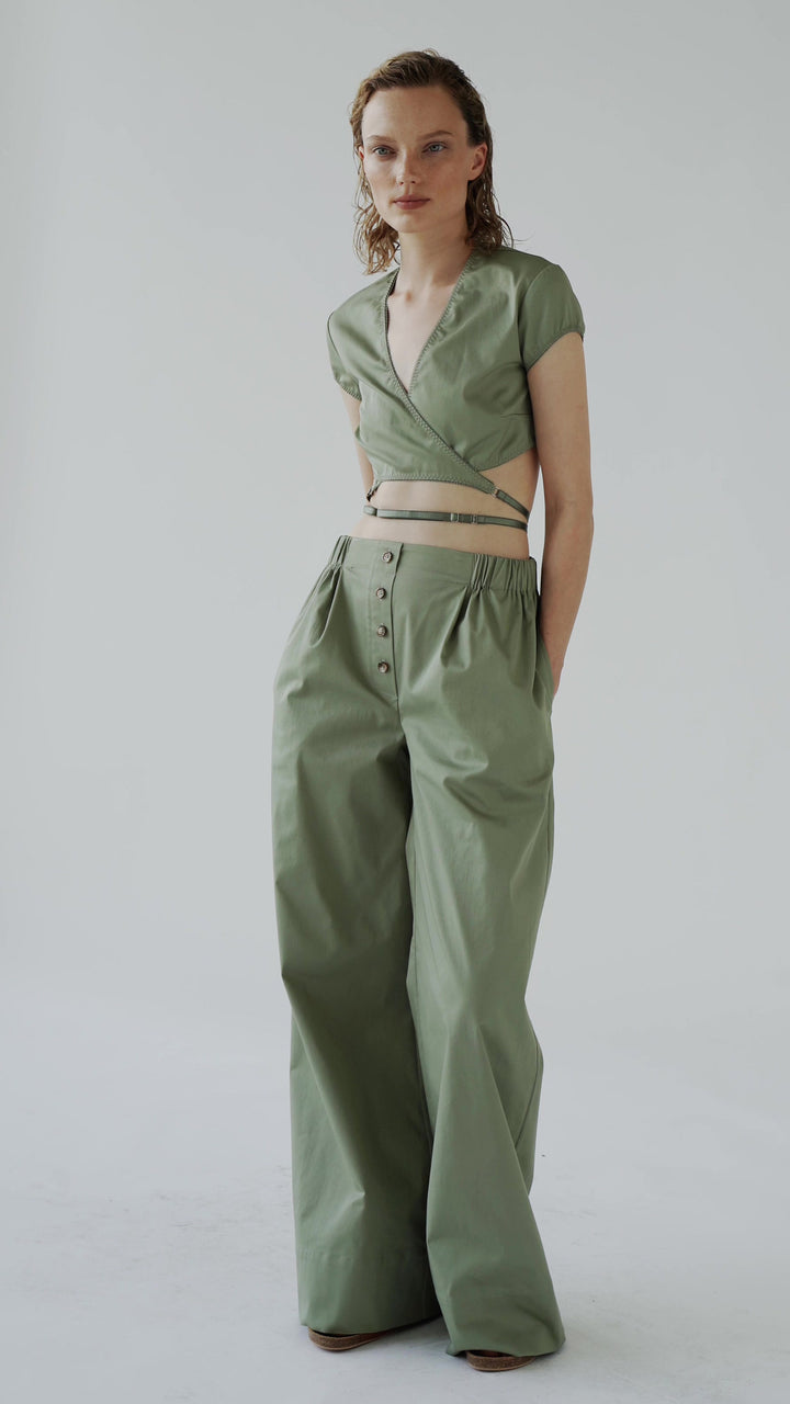 Model in olive Melba trousers video