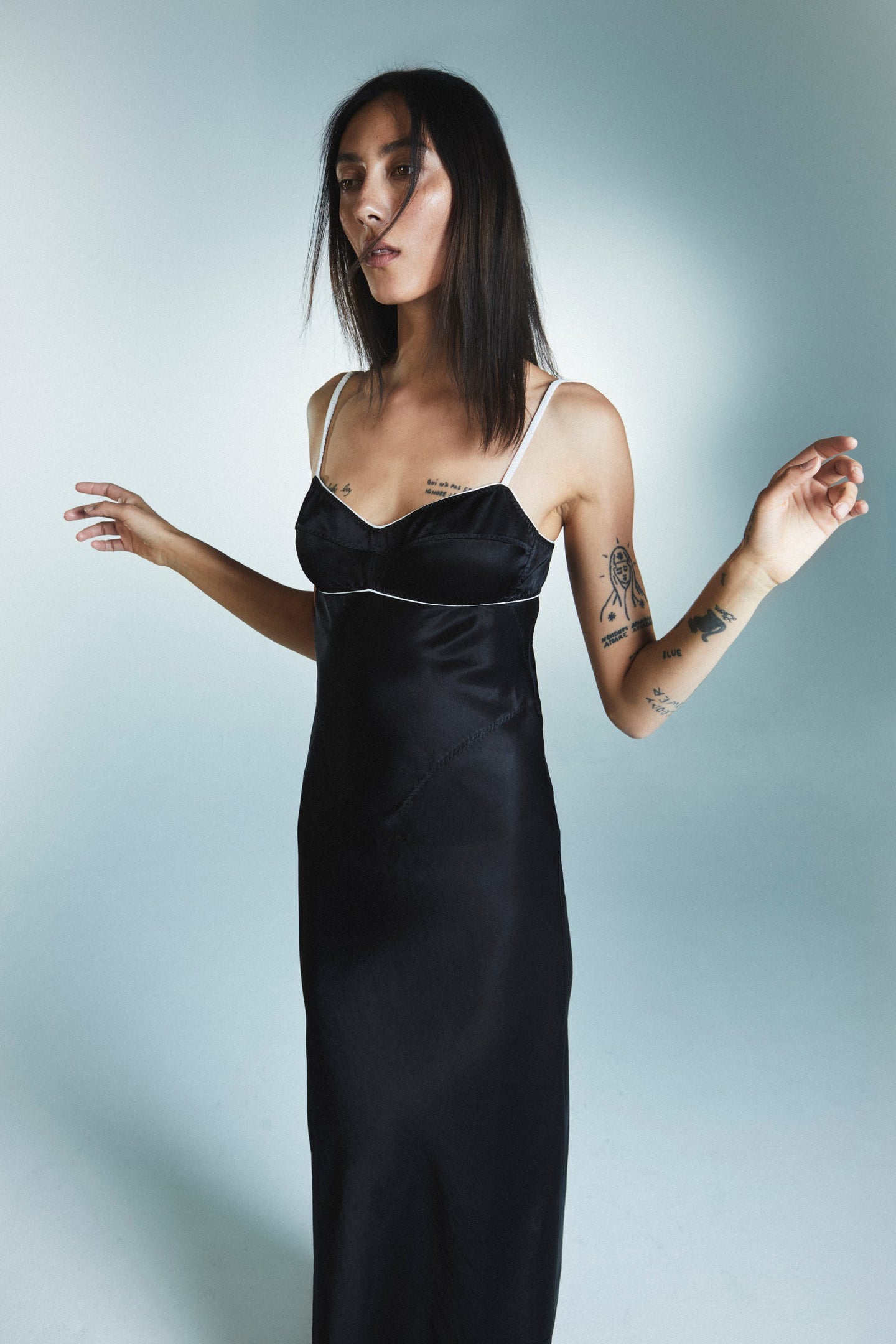 Model in black Lidi dress