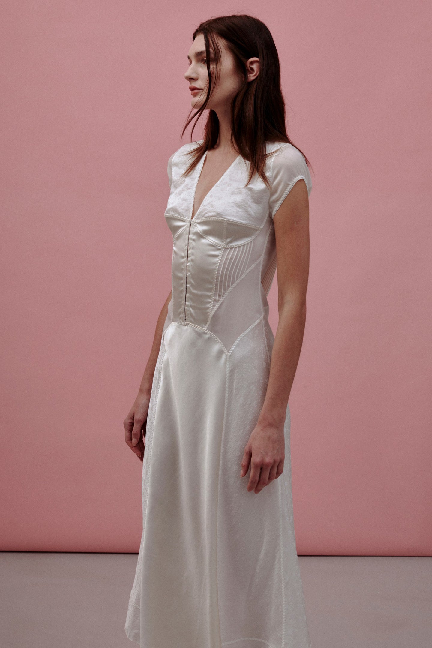 Model in white Ninel dress