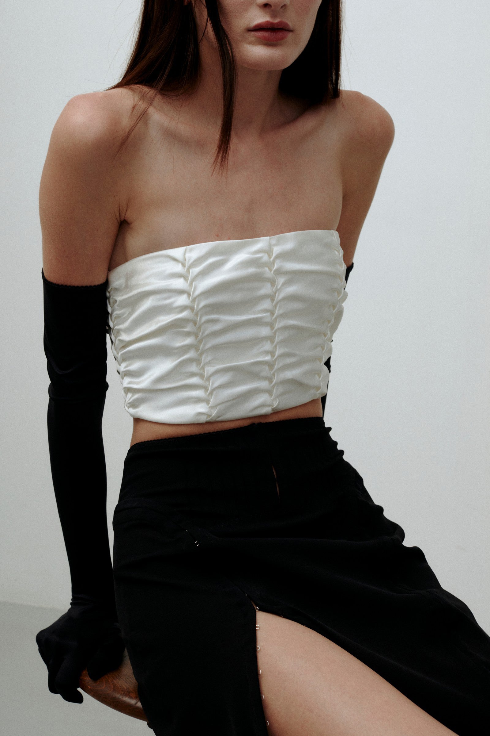 Model in ivory Kai top